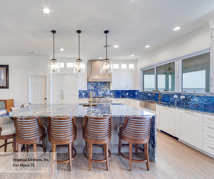 Coastal Luxe Kitchen with White Shaker Cabinets and Blue Quartzite Island